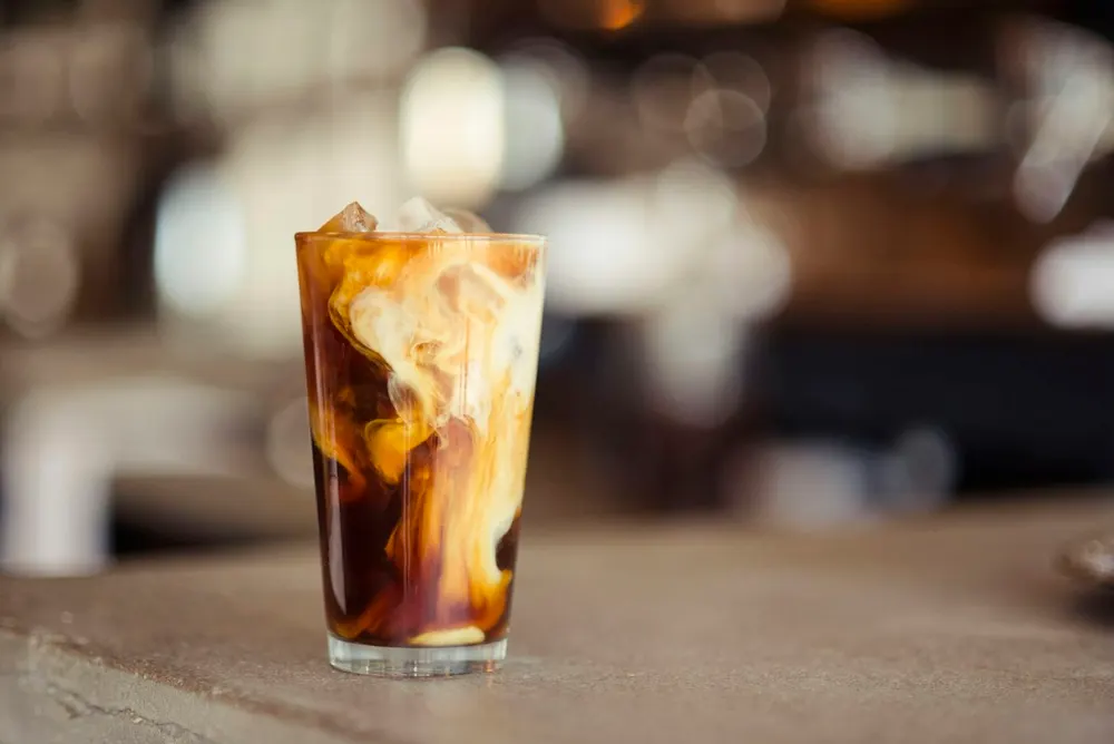 Denny's open on Thanksgiving iced coffee drink on the diner counter